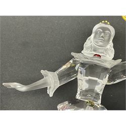 Swarovski Crystal Masquerade trilogy; 1999 Masquerade Pierrot, 2000 Columbine, 2001 Harlequin all with accompanying plaque, stand and original box, together with a glass display case with mirrored back and sides 