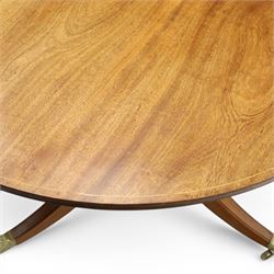 Acornman - mahogany twin pillar extending dining table, strongly grained top with inlaid edge, raised on a ring turned baluster column, above three swept supports terminating in brass paw feet above castors, two additional leaves extending the table to 242cm, with signature carved acorn, by the workshop of Alan Grainger of Brandsby