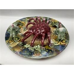 Five 20th Century Portuguese Palissy style Majolica wall plates, all depicting crustaceans to the centre modelled in relief surrounded by encrustations and shells, both with impress marks beneath, largest D29cm