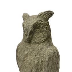 Pair of cast stone garden owls figures, on circular moulded plinths 