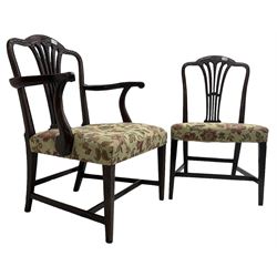 George III Hepplewhite design mahogany elbow chair and matching side chair, cresting rail carved with bellflowers over pierced and flared splat, seats upholstered in floral patterned fabric, raised on square tapering supports united by stretchers