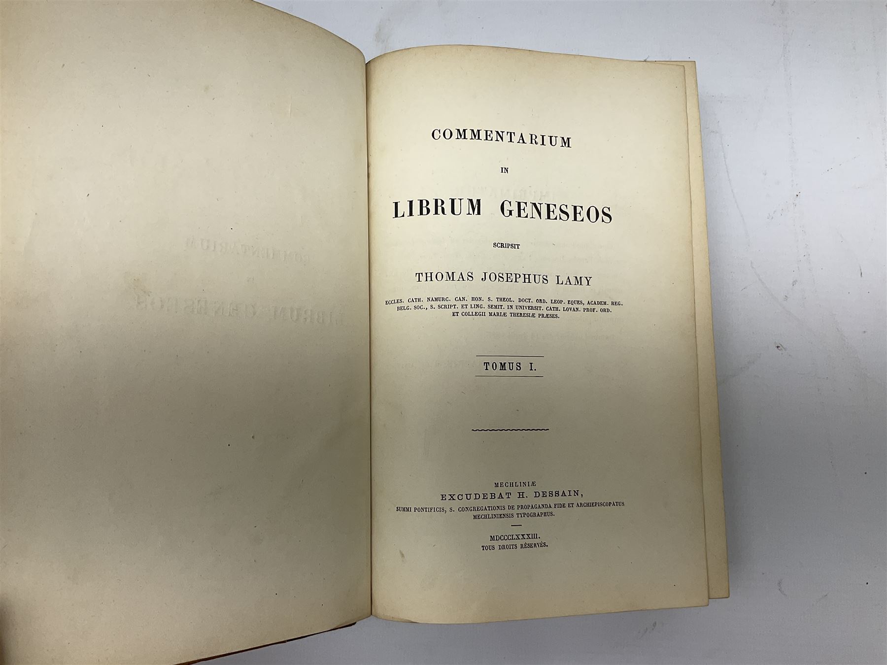 Eighteen 19th century leather bound books including Oeuvres Completes De Voltaire. 1827 Paris. Two volumes; Oeuvres De Pierre Corneille. 1892 Paris; Commentarium in Librum Geneseos Scripsit Thomas Josephus Lamy. 1883 Mechliniae; etc (18)