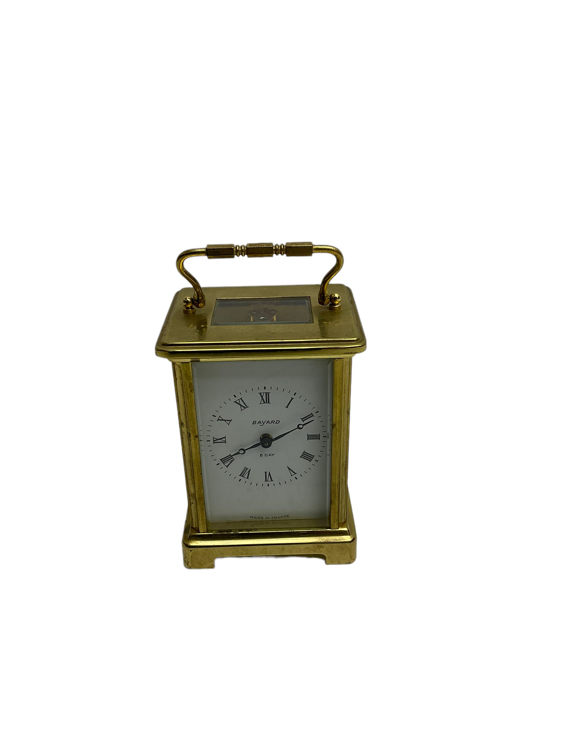  20th century French cornice “Bayard” 8-day timepiece carriage clock, with a lever platform escapement, enamel dial with roman numerals and minute track and Haller Torsion clock with acrylic dome
