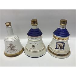 Bells, Scotch whisky, in five Wade ceramic decanters, together with Irish Mist  in novelty decanter, an empty Lambs Navy Rum decanter and similar items, of various content and proof, (11)