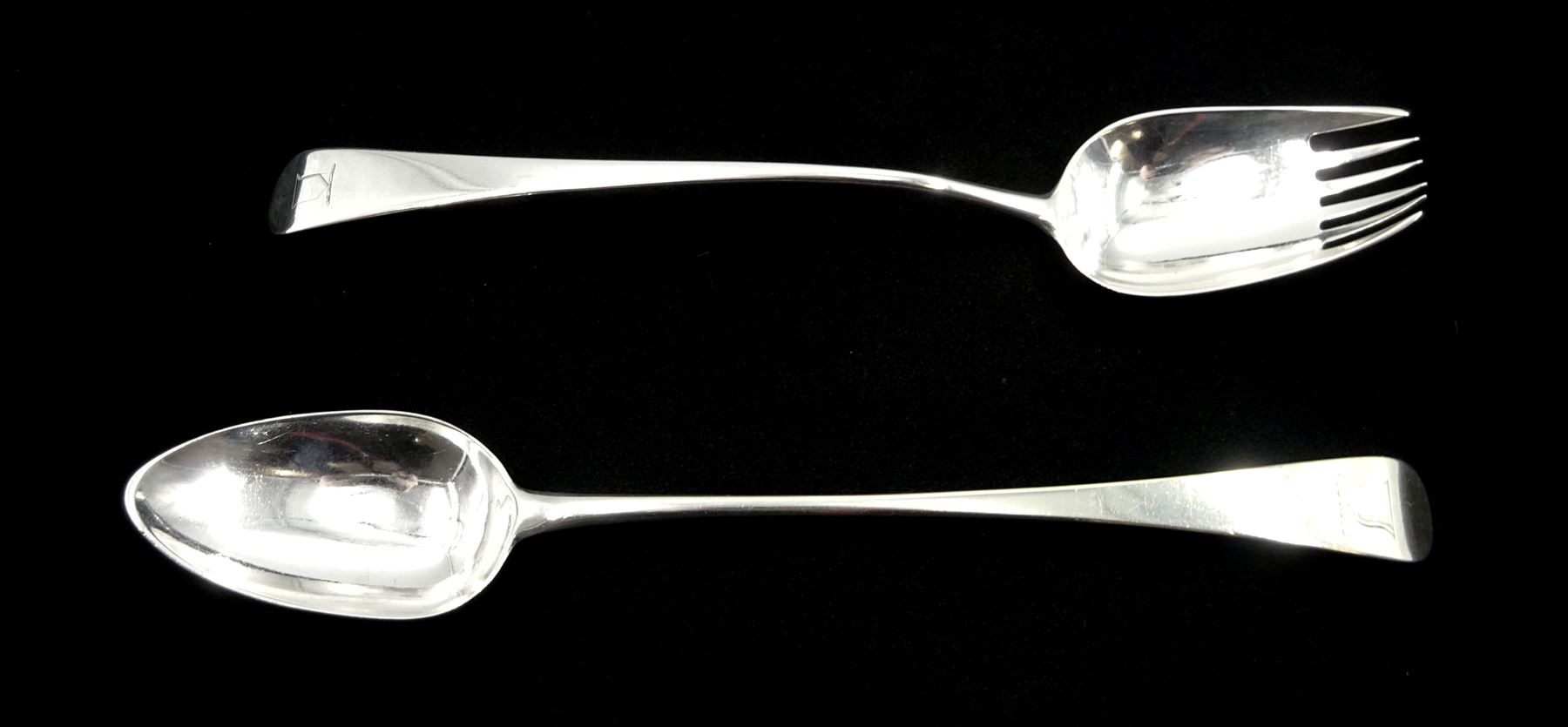 George III silver salad server by Richard Crossley, London 1791 and a George III silver basting spoon by Peter & Ann Bateman, London 1799, both Old English pattern with crest, approx 6.7oz