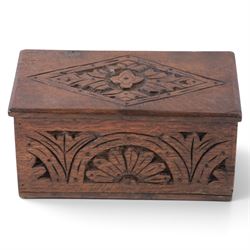 Carved oak box, the hinged lid with a carved diamond motif, the sides and front carved wit...