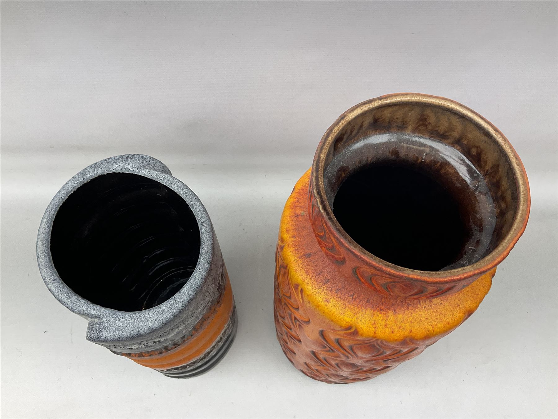 Two large West Germany pottery vases of cylindrical form with black and orange moulded decoration, with impressed marks beneath, largest H
