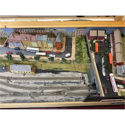 'Z' gauge continental scenic layout with folding legs, various loops of track and sidings with overhead cables, buildings including water tower, tunnels, roads with motor vehicles and figures, trees, haven with boats, backdrop diving wall hiding control units 150 x 50cm