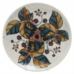 Moorcroft plates, to include the 1996 Year Plate limited edition number 106/500, with certificate, and two Brambles pattern plates, each with impressed and painted marks to base, D22cm (3)