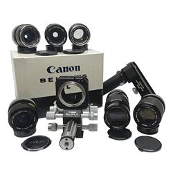 Collection of Canon lenses, to include 'Canon Lens FD 100mm 1:2.8', serial no 12821, 'Canon Lens FD 200mm 1:4' serial no 245313, 'Macro Canon Lens FL 50mm 1:3.5', serial no. 25505, 'Canon Lens FD 135mm 1:3.5 etc, together with other Canon equipment, including Bellows FL, Slide Duplicator etc 