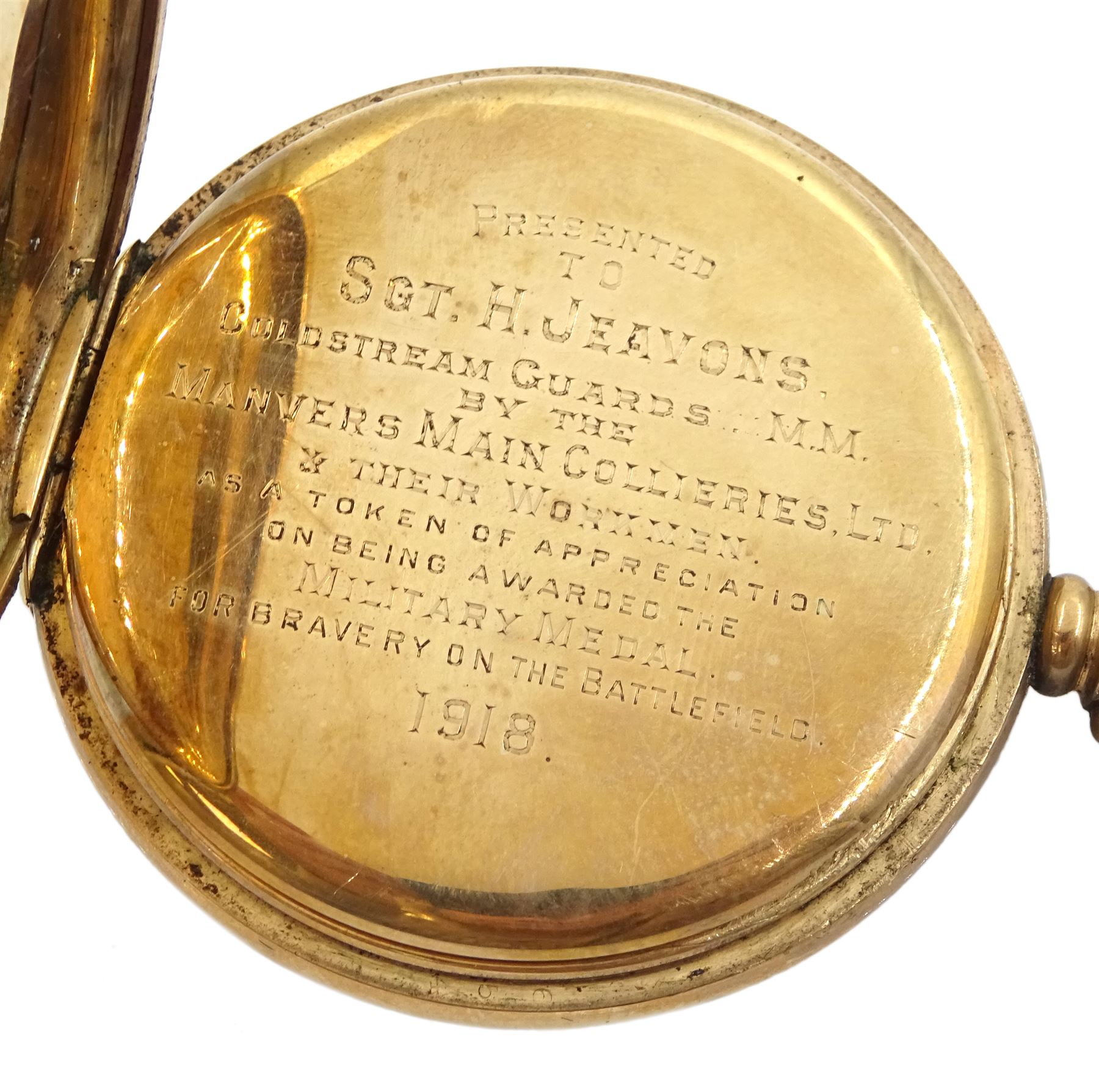 Early 20th century 9ct gold open face keyless lever presentation pocket watch, inner cover inscribed 'Presented to Sgt. H. Jeavons. Goldstream Guards M.M by the Manvers Main Collieries Ltd & their Workmen as a Token of Appreciation on Being Awarded the Military Medal for Bravery on the Battlefield 1918', case by Dennison, Birmingham 1917