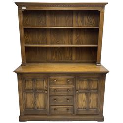 Ercol - mid-20th century dark elm 'Old Colonial' dresser, two tier plate rack with fluted uprights, base fitted with four drawers flanked by two panelled cupboards