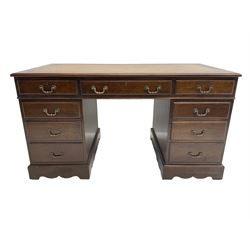 Early 20th century mahogany twin pedestal desk, fitted with nine drawers, with inset leather top