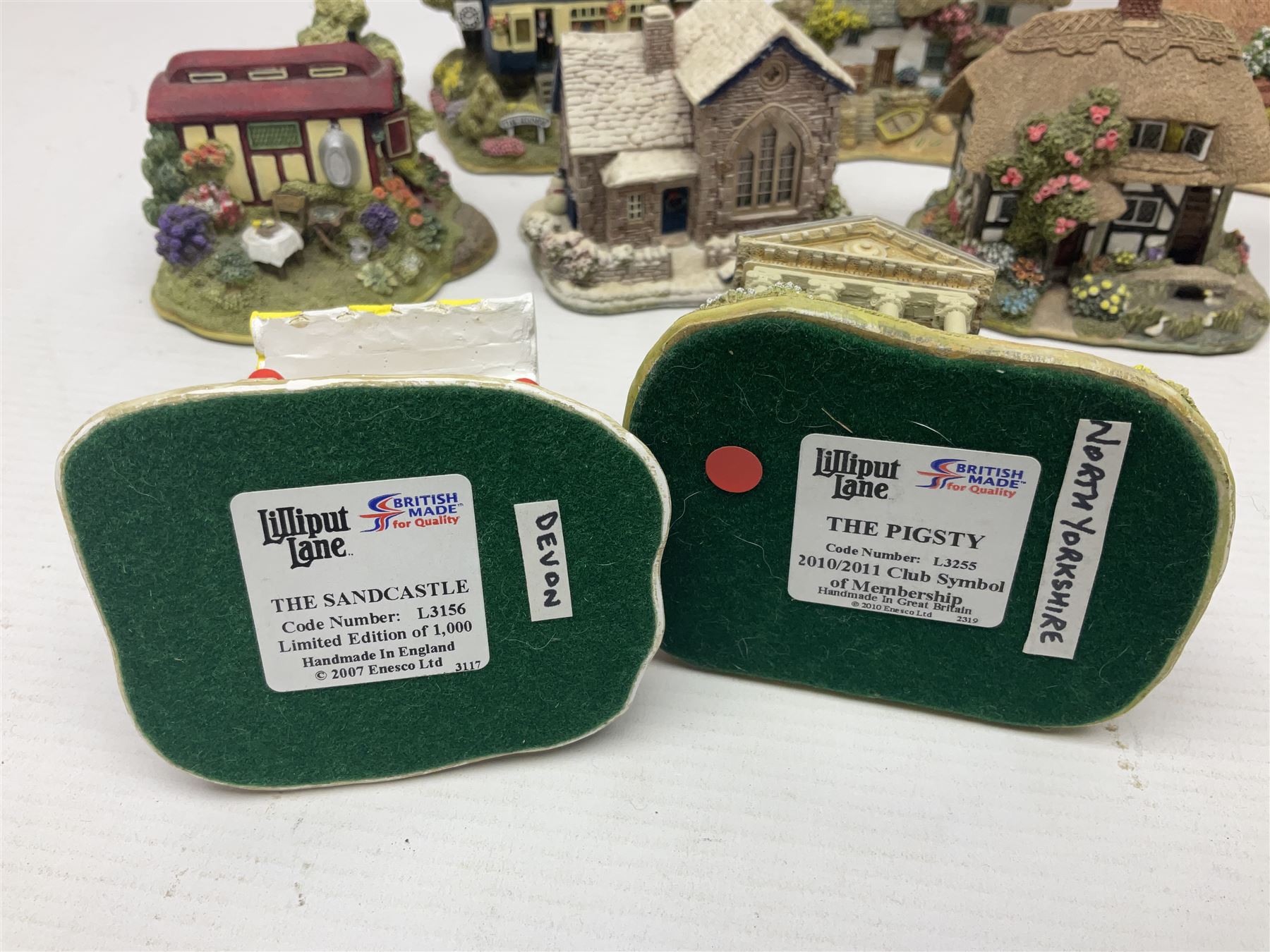 Eighteen Lilliput Lanes, including The Penny Farthing, The Pigsty, Borrowdale School, Fairy Cake Tearoom, An Apple a Day,Ladybird Cottage etc, all with original boxes 