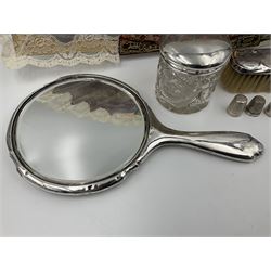 Silver clothes brush, mirror, glass dressing table jar and thimble, all hallmarked, together with a souvenir fan depicting scene after Goya, and two silver plated thimbles, 
