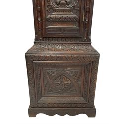 18th-century profusely carved oak longcase clock - with a pagoda pediment, upstands and carving, 
 break arch hood door flanked by reeded pilasters with brass capitals, trunk with canted corners and a spire topped door, square plinth with applied skirting, break arch brass dial with wheatsheaf engraving and cast cherub and crown spandrels, engraved break arch with the London clockmakers name John Gordin, silvered chapter ring with Roman numerals, five minute Arabic's, minute and quarter hour tracks, matted dial centre with ringed winding holes, square date aperture and seconds ring, dial pinned to a five pillar movement with inside countwheel striking, striking the hours on a cast bell. With weights and pendulum. John Gordin, is possibly a mis-spelling or phonetic spelling of John Gordon, of London, who worked from Ludgate Street in the parish of St. Gregory by St. Pauls. Apprenticed in 1689 and died in 1732 when his will was proven.
