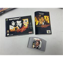 Nintendo 64 console, two controllers, games and accessories. Accessories to include the ‘Tremorpak’ and ‘Spook’ 2 Phono plugs and a S-VHS plug with adapter, both in original boxes. Games to include ‘Golden Eye 007’, ‘Doom 64’, ‘Killer Instinct Gold’, ‘Tetrisphere’, ‘F-1 World Grand Prix’, ‘Pilotwings 64’ and ‘Lylatwars’ with ‘Rumble Pak’, all with original boxes and instruction manuals. ‘Star Wars Episode I Racer’ game cartridge in Shadows of the Empire box. 