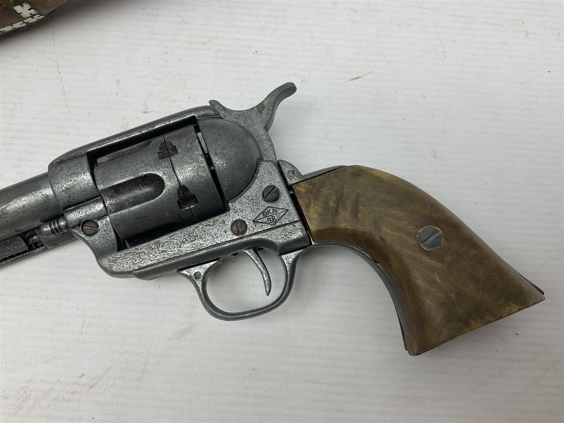Modern non-firing reproduction Tower flintlock pistol marked with crowned GR and Tower to the lock, brass skull crusher butt and fittings L40cm overall; another Indian/Moorish reproduction flintlock pistol with mother-of-pearl inlay; and a modern die-cast replica Colt style revolver (3)