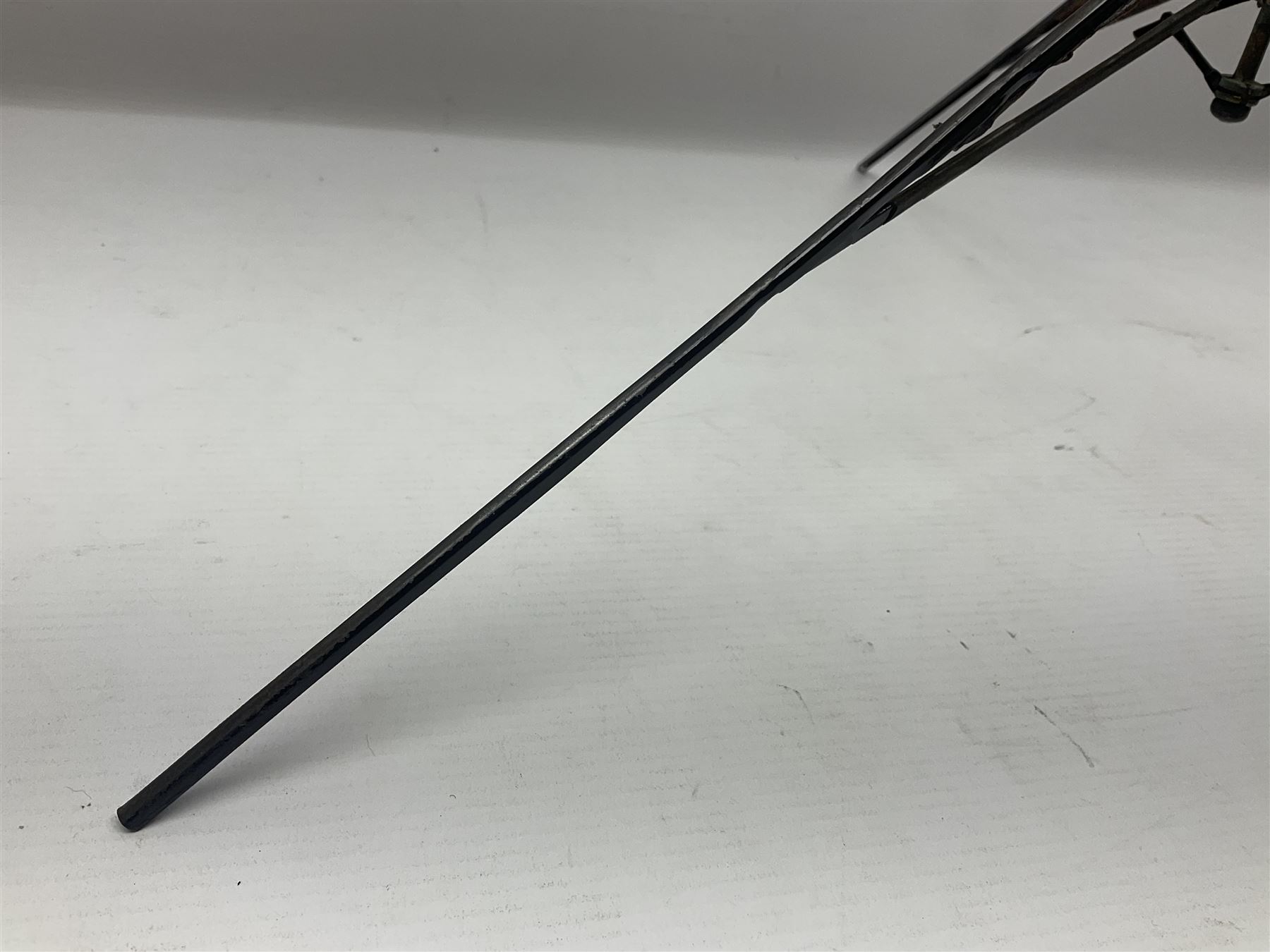 Victorian magician's cane, the mahogany walking stick twisting apart to reveal an internal mechanism, opening to tripod and black silk fold out magician's table, with horn handle and silver mount, hallmarked Birmingham 1891