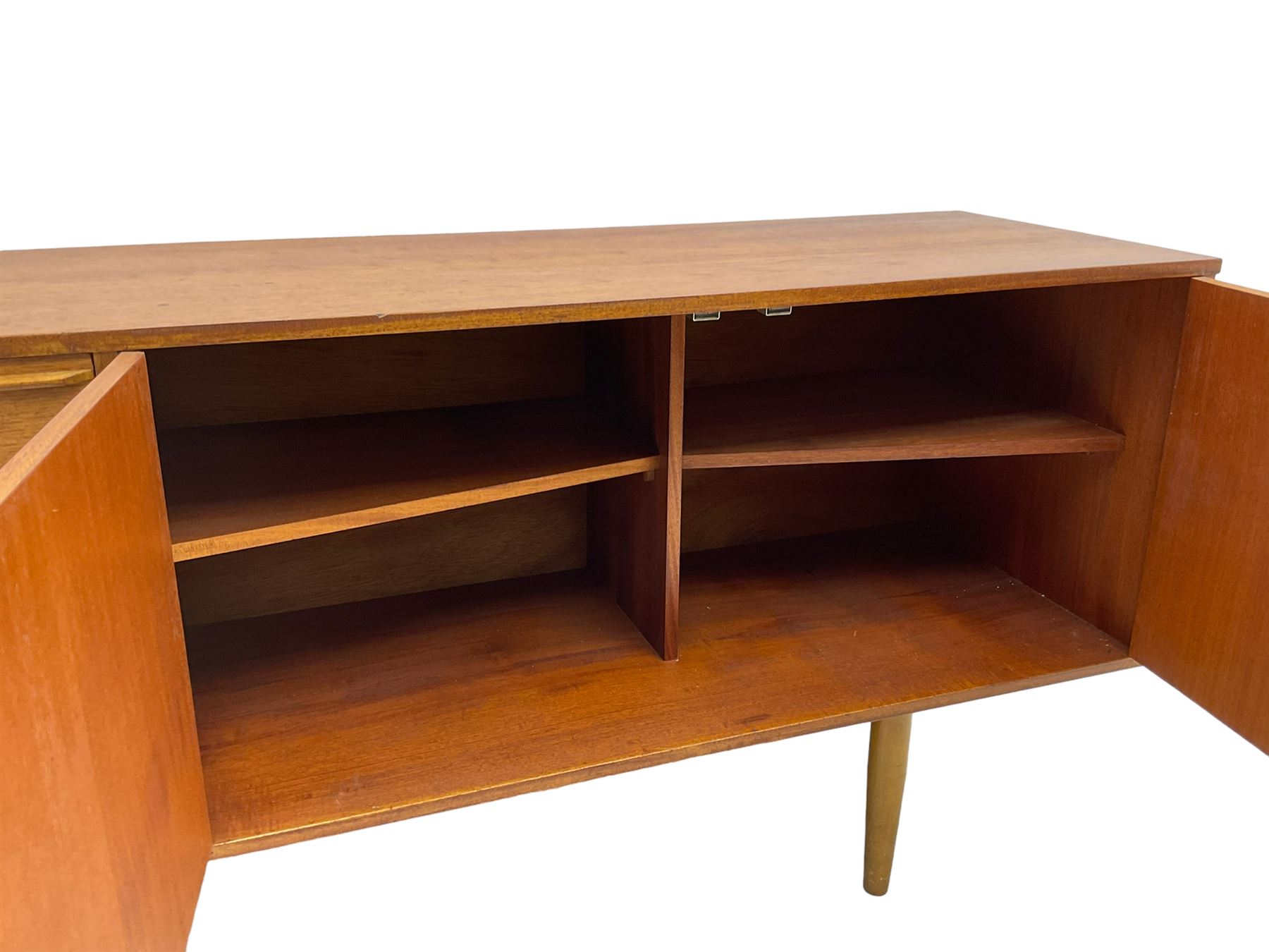 Morris of Glasgow - mid-20th century teak sideboard, fitted with double cupboard and single drawer above fall-front cabinet, raised on tapering supports