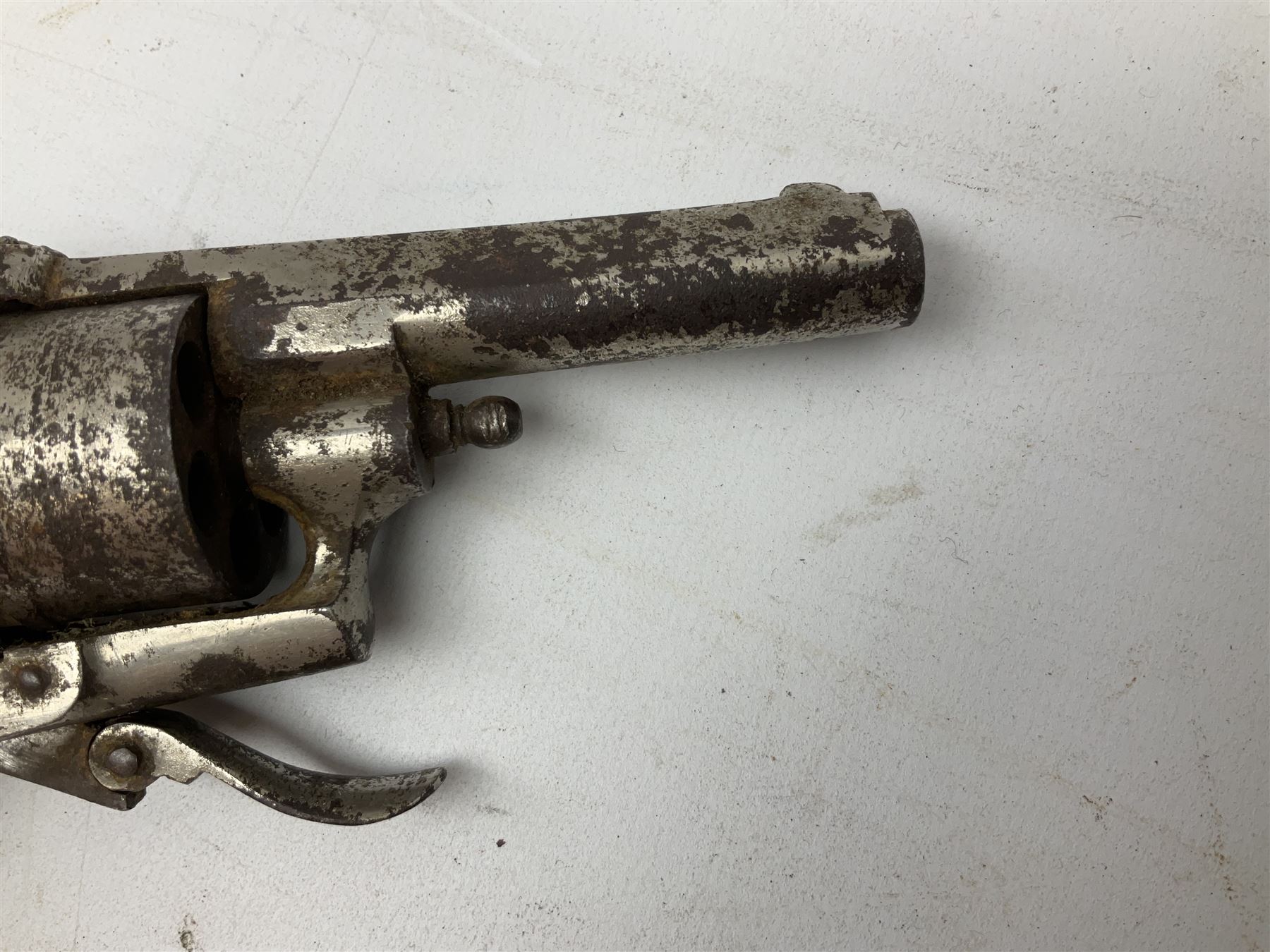 19th century 7mm six-shot pin-fire revolver, with folding trigger, two-piece ebonised grip and ejector rod in butt L17cm