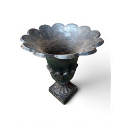 Pair of Victorian large scale cast iron garden urns, flared petal shaped rim with tapering waist, gadrooned base on square plinth, finished in black paint