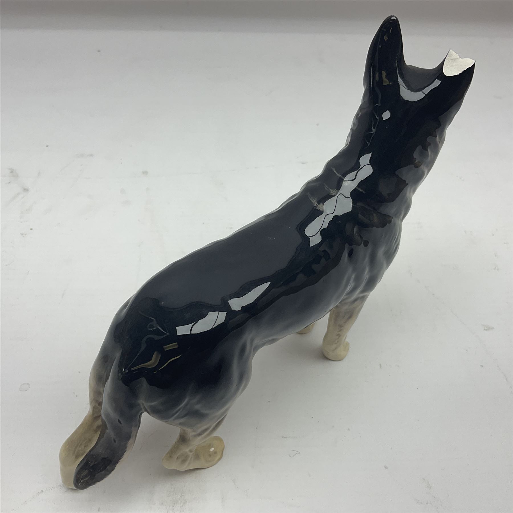 Three Beswick dog figures comprising Corgi Black Prince 1299A Sheep Dog 1792 and Ulrica of Brittas German Shepherd 969 Decorative Antiques Collectors