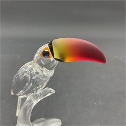 Three Swarovski Crystal bird figures, comprising Toucan, pair of puffins and pair of parrots on a branch, tallest H10cm
