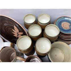 Wold studio pottery tankards, in various colours and relief decoration together with other studio items including vases, jugs and pots 