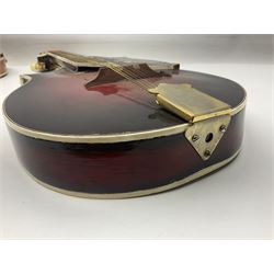 Eastern eight-string mandolin with sunburst finish and mother-of-pearl inlay L68.5cm; and another Harmony mandolin with cracked headstock (2)