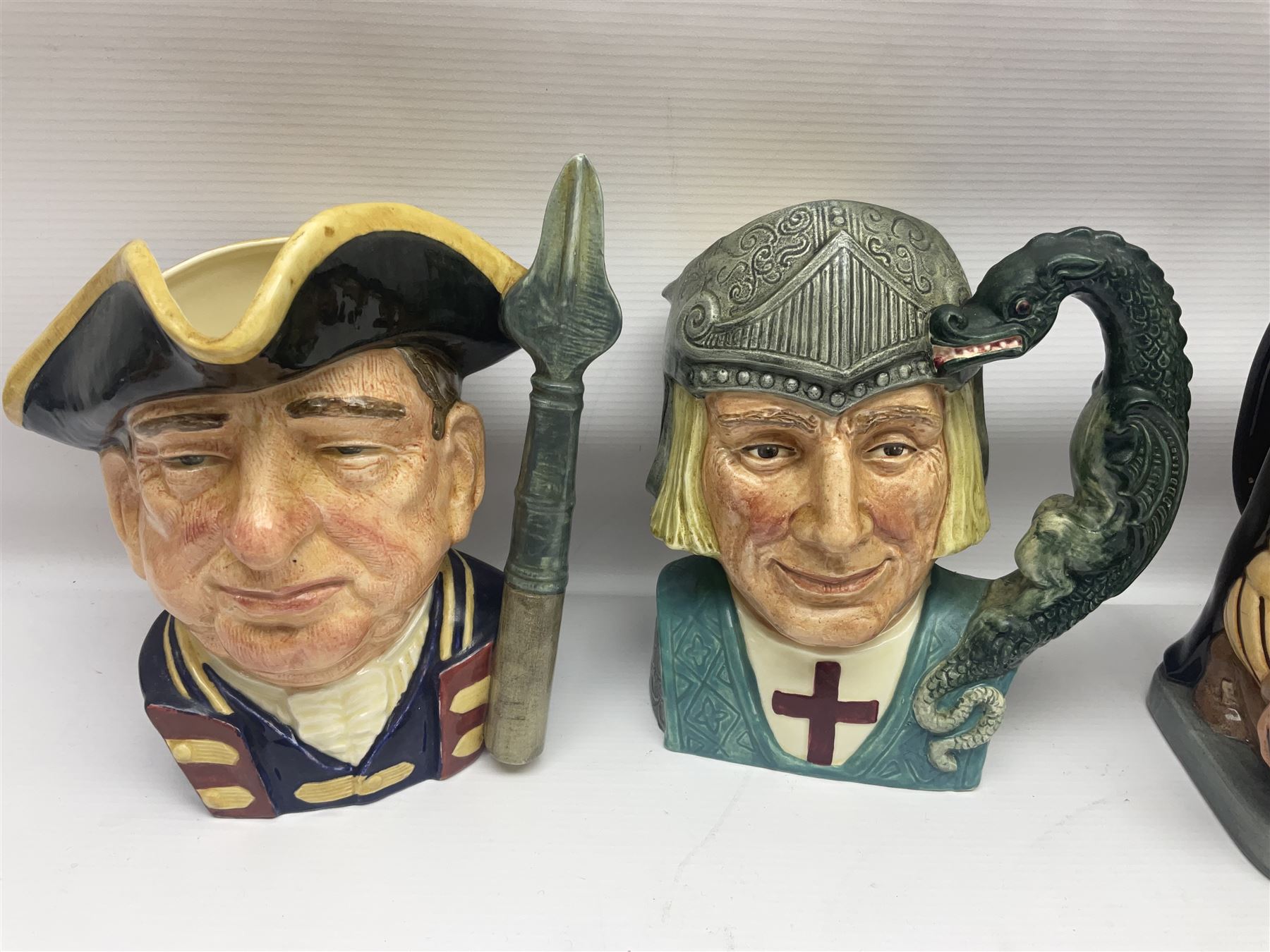 Eight Royal Doulton character jugs, including St George D6618, Guardsman D6568, The Juggler D6835 etc, together with Royal Doulton toby jug Sir Francis Drake D6660