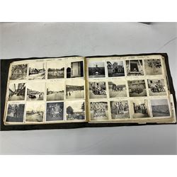 Postcards and postal history, including WWII period items, topographical postcards, military themed postcards including 'Daily Mail Battle Picture', 'War Bond Campaign Post Card' etc, housed in three ring binder albums, and an album containing various photos of men in military uniform dating from the late 1940s