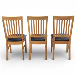 Solid light oak extending dining table with single leaf, and set of six chairs