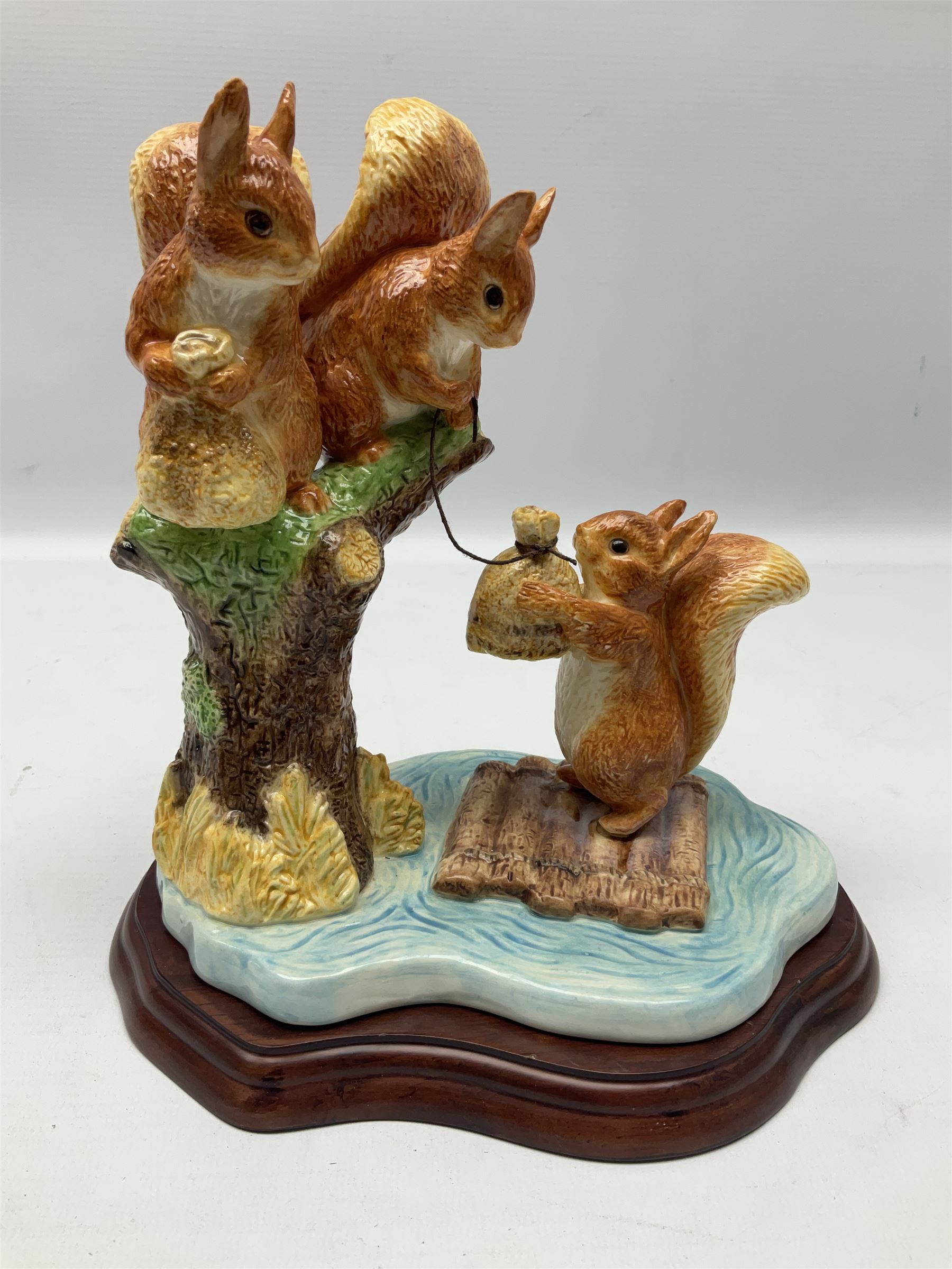 Four Border Fine Arts Beatrix Potter figures, comprising Tableau created to commemorate the Millenium together with a Border Fine Arts Limited Edition no 669814, The Tale of Peter Rabbit Tablet A1306, Four Little Rabbits A2442 and Sailing Home A2443