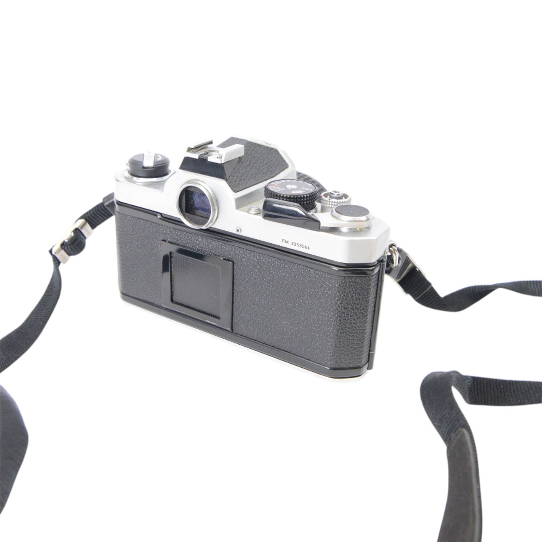 Nikon FM SLR camera body serial no. 2253063, together with a Nikkor 50mm 1:1.8 lens serial no. 2154684, Nikon Series E 75-150mm 1:3.5 zoom lens serial no. 3060109 and an Ohnar zoom slide duplicator