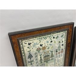 Two framed needlework samplers, the first example depicting a house and garden scene, the second cherubs