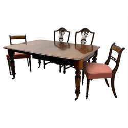 
Late Victorian mahogany extending dining table and four chairs, rectangular top with rounded corners and moulded edge, fitted with two additional leaves, raised on turned and reeded legs with brass castors, with a pair of Victorian mahogany hall chair, with curved top rail and plain splat, padded seat in textured salmon pink fabric, raised on turned and tapering front legs and another pair of early 20th century mahogany dining chair, with shield back and carved pierced splat, serpentine seat rail with striped upholstered cushion, raised on moulded square front legs