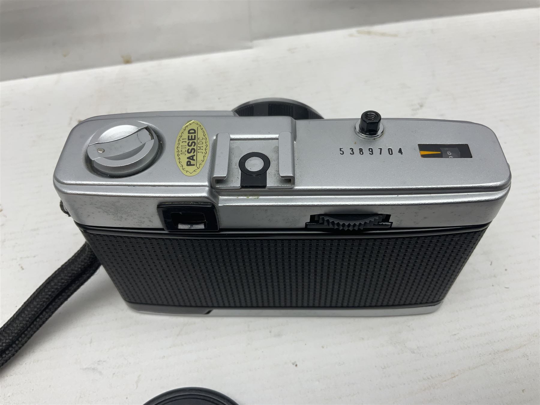 Four Olympus camera bodies, including Olympus OM10, serial no 20744269, with 'Olympus OM-System Zuiko Auto-S 50mm 1:1.8' lens serial no 3633644, Olympus OM-2 camera body serial no 460280 with 'Olympus OM-System G.Zuiko Auto-s 1:1.4 f=50mm' lens, serial no 729750, etc 