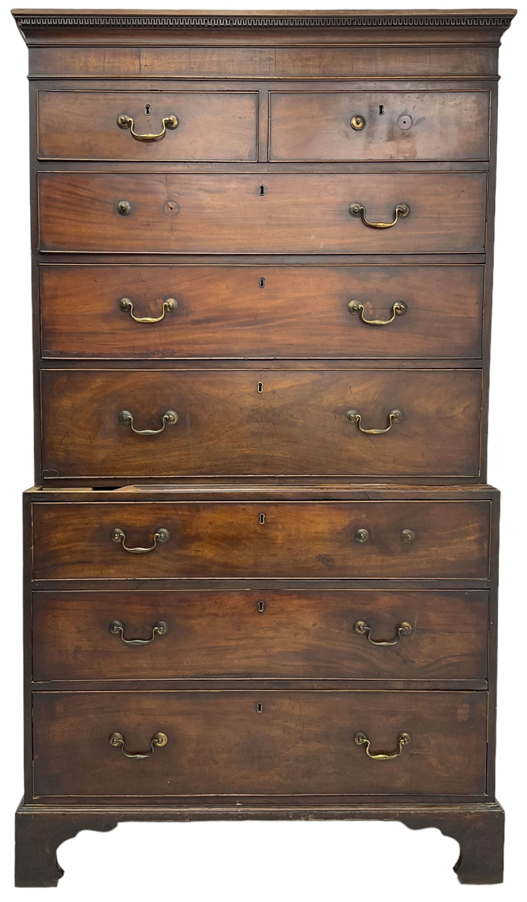 George III mahogany chest on chest, projecting cornice over plain frieze, fitted with two short and six long graduating cock-beaded drawers, on bracket feet