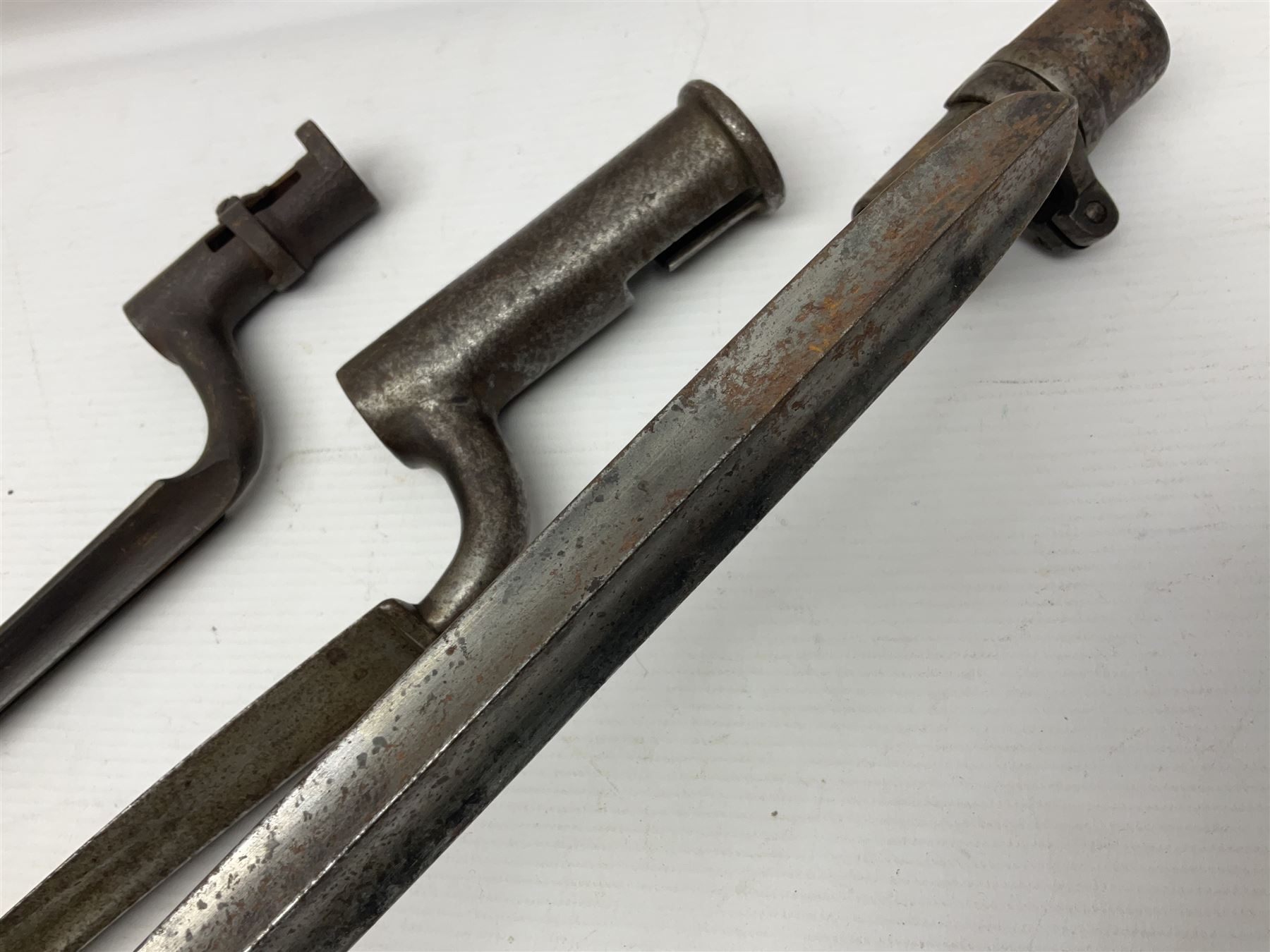 Early 19th century British Brown Bess musket rifle socket bayonet with zigzag fitting stamped D71 and triangular blade stamped 270 L55cm overall; and two other 19th century socket bayonets; no scabbards (3)