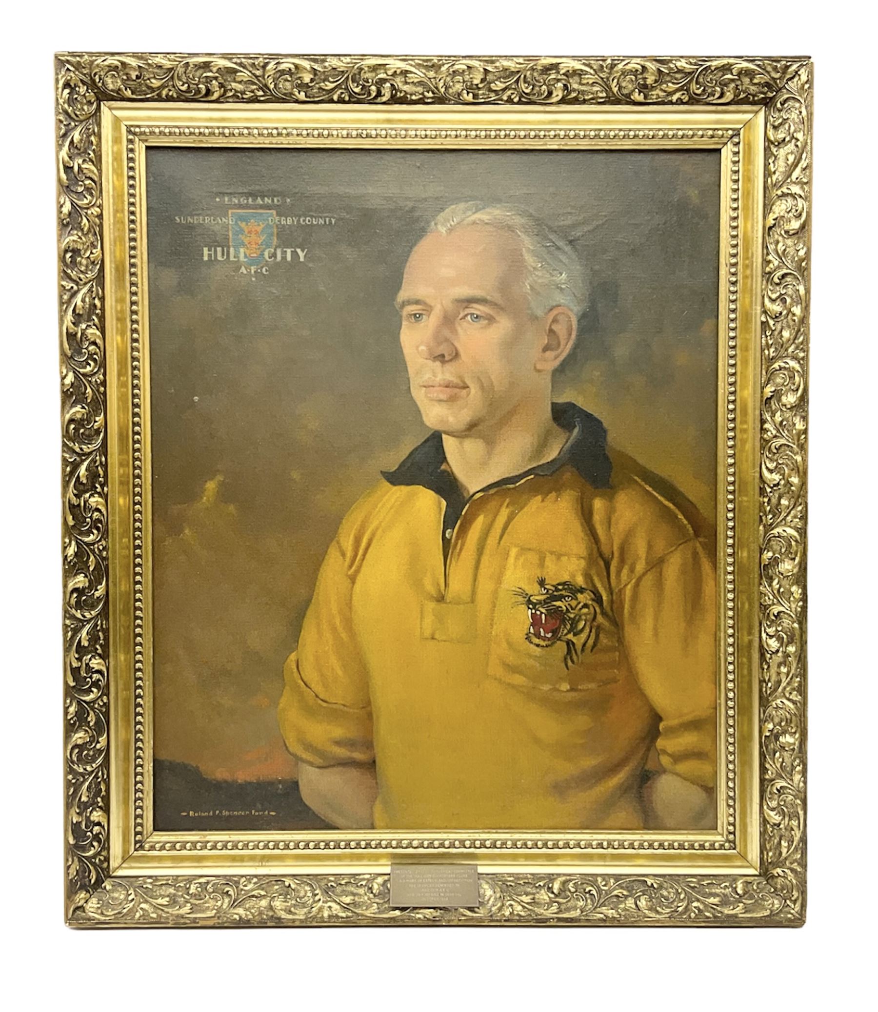 Roland F. Spencer Ford (1902 - 1990), oil painting on canvas, half length portrait of Raich Carter, standing dressed in Hull City kit, the Hull town crest in the background surrounded by the names Hull City A.F.C., Sunderland, Derby County and England, bears label verso from the studio of the artist in Newstead Street, Hull with original price of £75, signed, 59.5 x 49.5cm, gilt frame with metal plaque inscribed ' Presented by the Management Committee/of the Hull City Supporters Clubs/as a mark of esteem and appreciation/for services rendered to/Hull City A.F.C./and to football in general/October 1952'. Provenance: By direct descent from the family of Raich Carter having been consigned by his daughter Jane Carter.