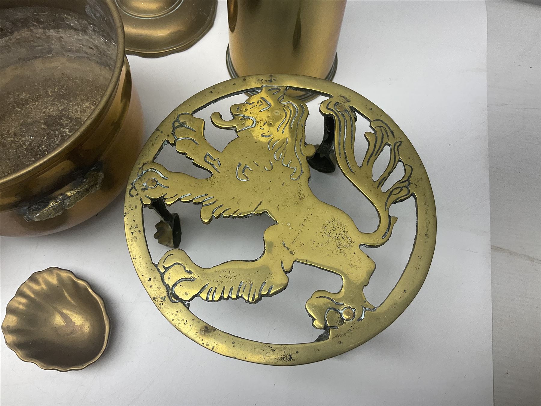 Collection of brassware, to include two jardinieres, candle sticks, brass shell, etc