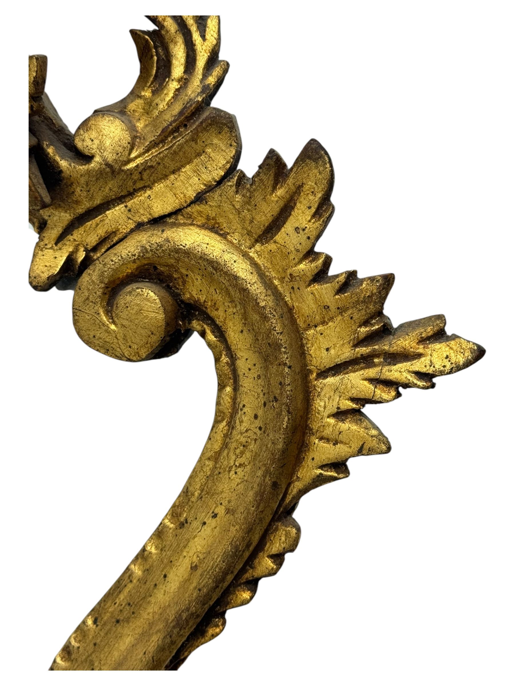 18th century design gilt framed wall mirror, within a pierced and scrolling foliate frame, leaf sprays and flowerhead cresting