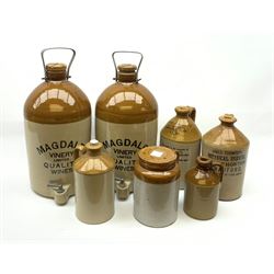 A group of stoneware bottles, to include to large examples detailed Magdale Vinery Limited Quality Wines, two smaller marked Harry Holgate City Beverages Whithall Road Leeds, and James Thompson Botanical Brewer Great Horton Bradford, and three smaller unmarked, largest including carry handle H47cm.