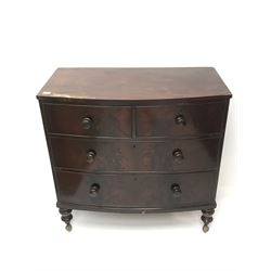 Victorian mahogany bow front chest, two short and two long drawers, turned supports