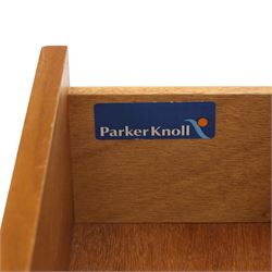 Parker Knoll - teak bureau, sloped fall front enclosing fitted interior, over two short drawers and two panelled cupboard doors