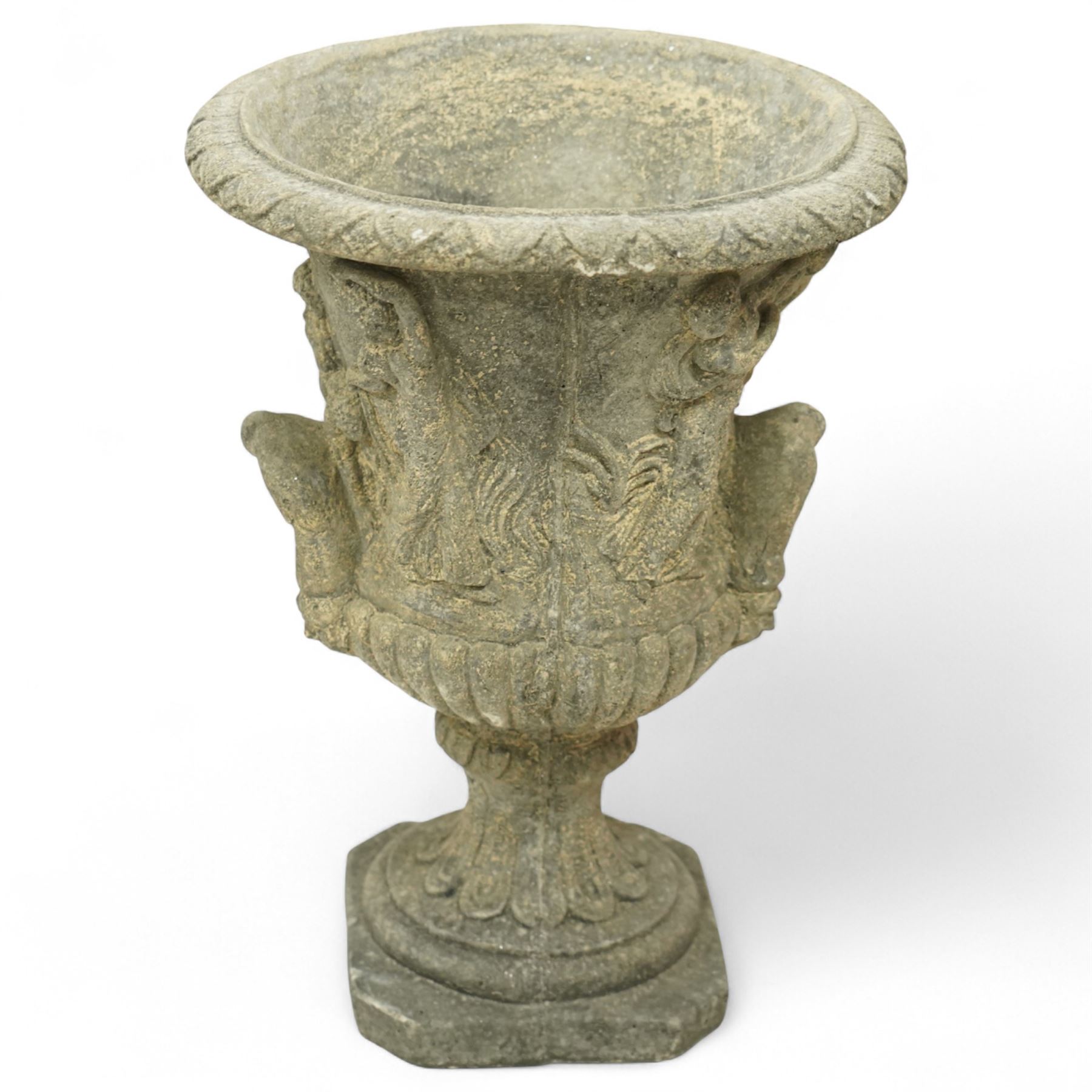 Late 20th century set of four composition stone campana urns, each with everted rim over acanthus and mask relief decoration, tapering to a fluted socle on square plinth base