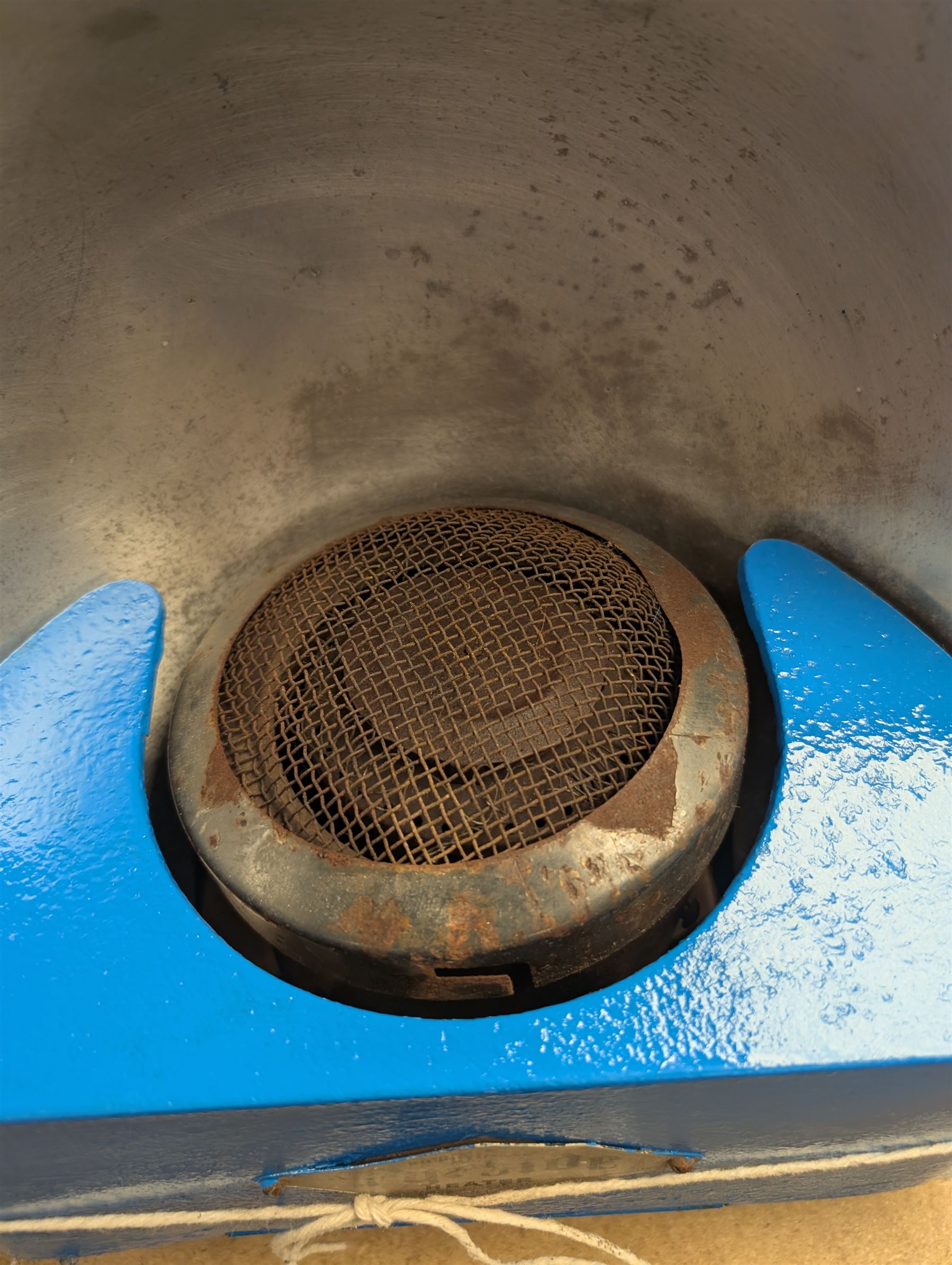 Mid 20th century Rippingilles Fyrside heater, painted in blue and white finish, with two empty glass paraffin bottles