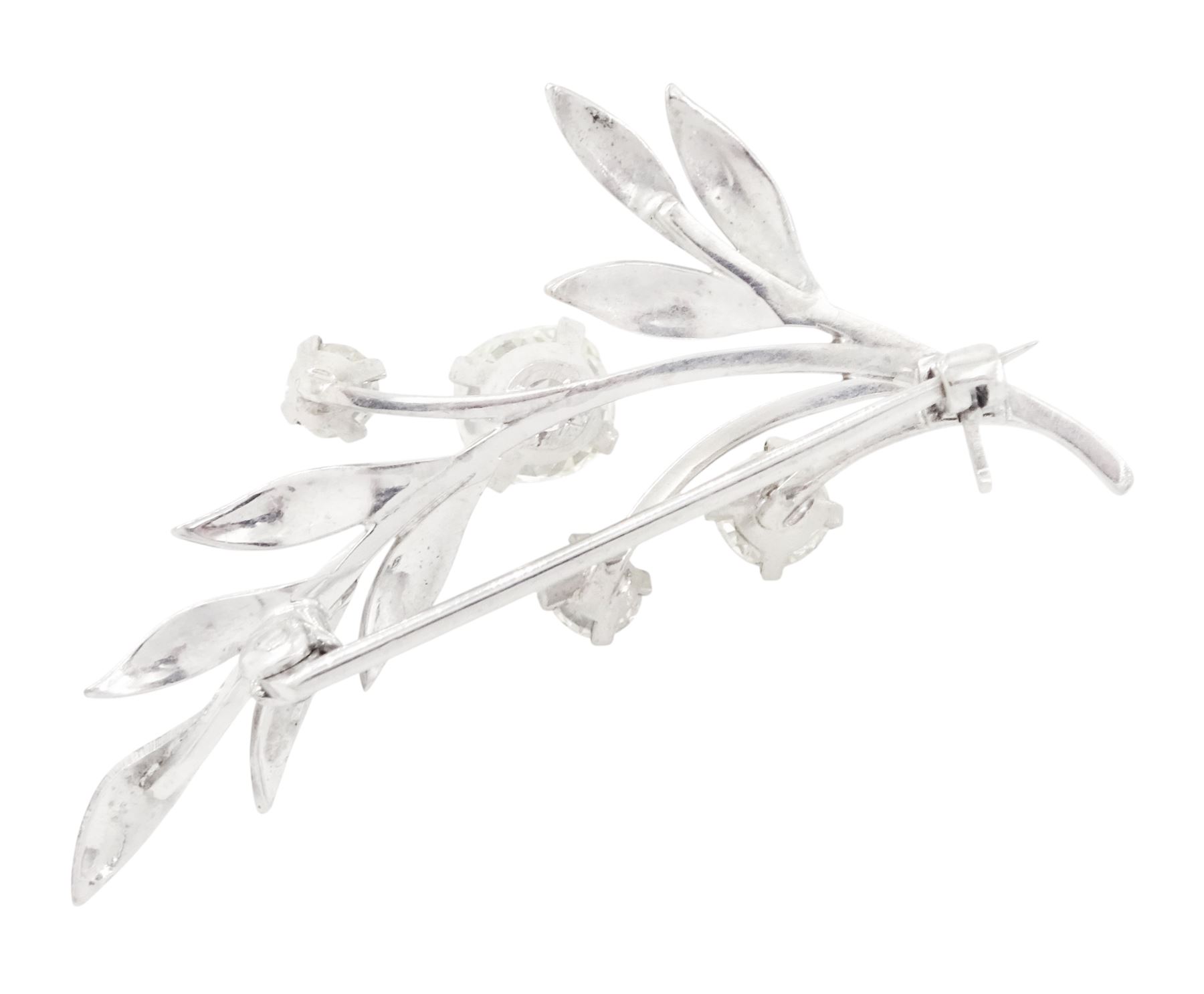 18ct white gold diamond flower brooch, set with a principal old cut diamond of approx 1.00 carat, surrounded by three further old cut diamonds, total diamond weight approx 1.75 carat