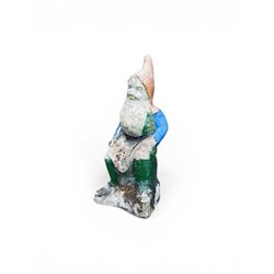 Early large scale composite stone garden gnome, original distressed paint